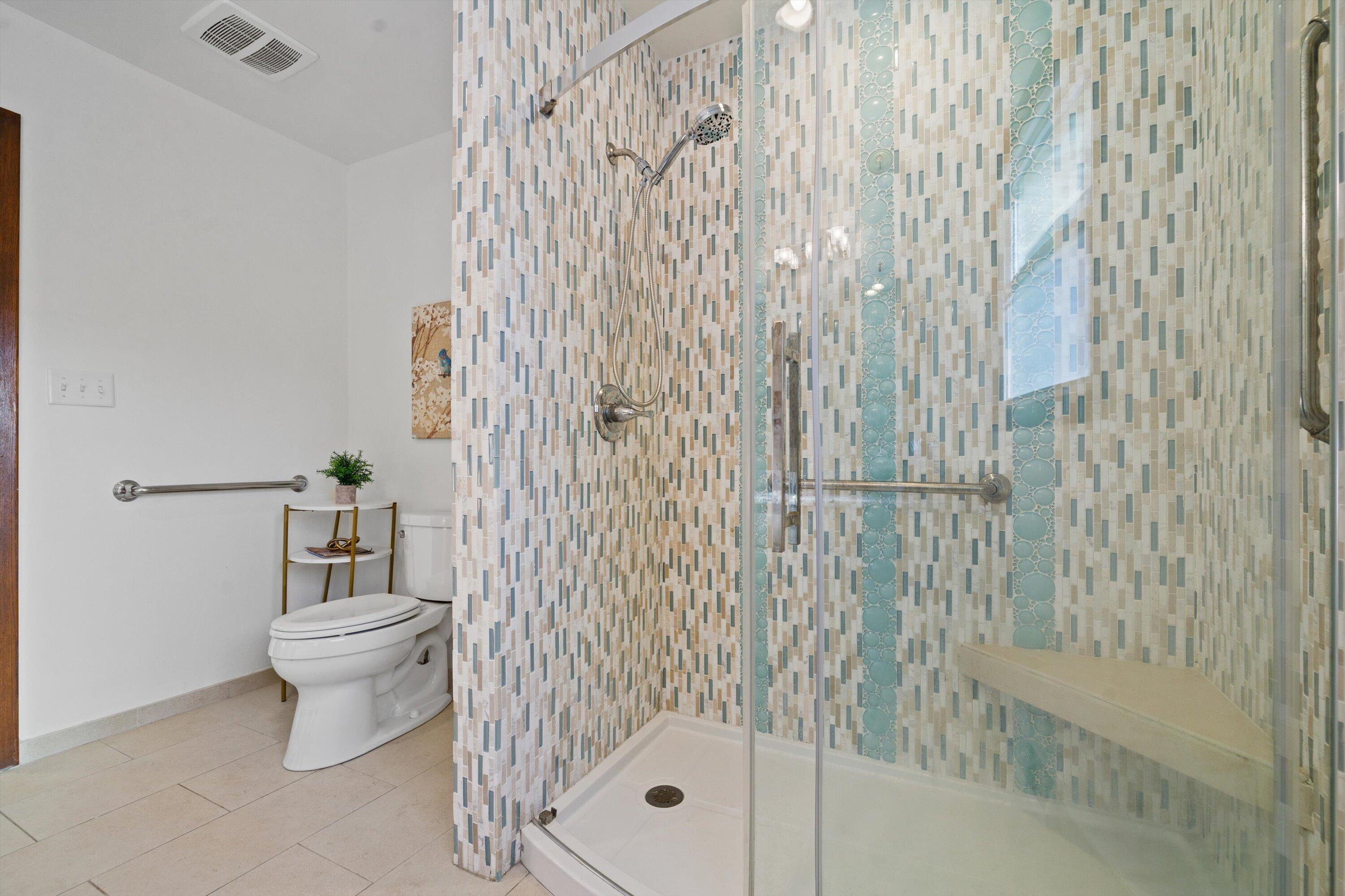 726 Royal Park Road Caledonia, WI 53402 - Photo 10 of 29 Tiled walk-in shower with glass door and built-in seat adds a polished, updated touch