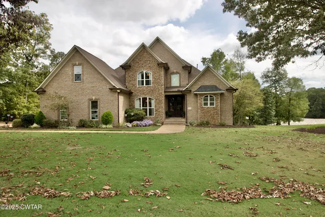 a living room with lots of furniture and a flat screen tv