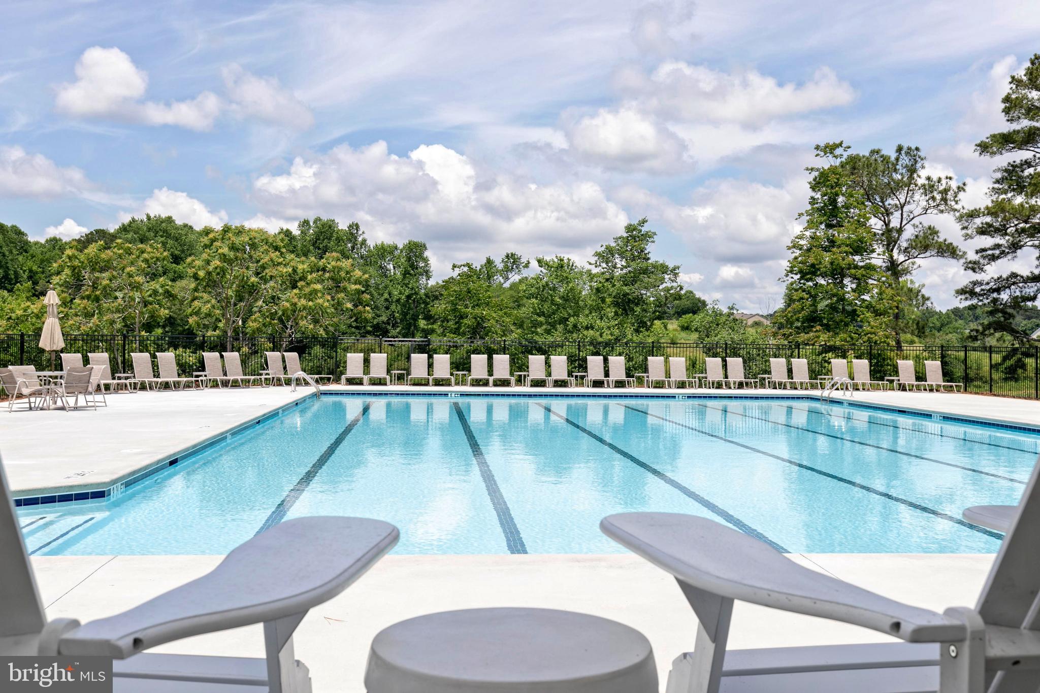 13720 Cobble Loop Woodbridge, VA 22193 - Photo 27 of 28 a view of a swimming pool with a chairs