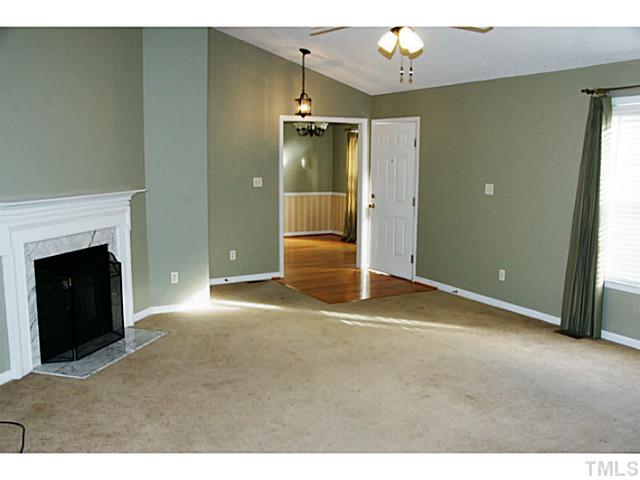 1432 Harvey Johnson Road Raleigh, NC 27603 - Photo 4 of 25 a view of a livingroom with a fireplace