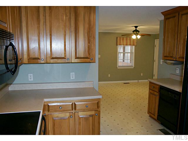 1432 Harvey Johnson Road Raleigh, NC 27603 - Photo 9 of 25 a bathroom with a sink and a mirror
