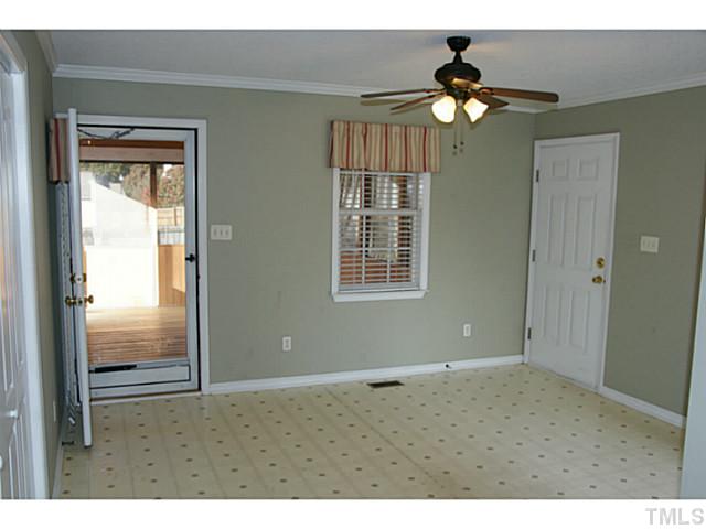 1432 Harvey Johnson Road Raleigh, NC 27603 - Photo 10 of 25 a view of an empty room with window chandelier fan
