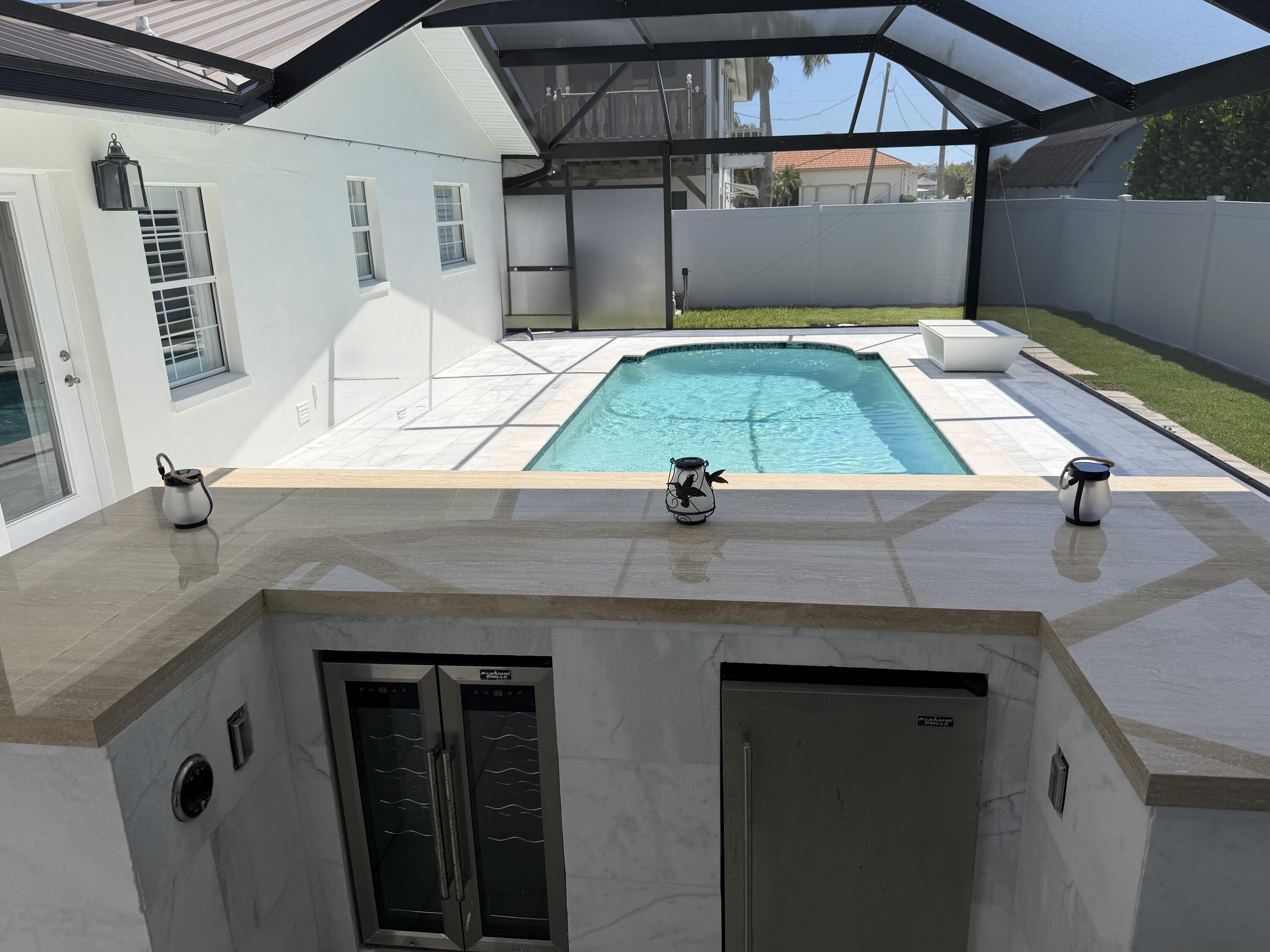 112 Capri Boulevard Naples, FL 34113 - Photo 25 of 29 a view of a house with a swimming pool