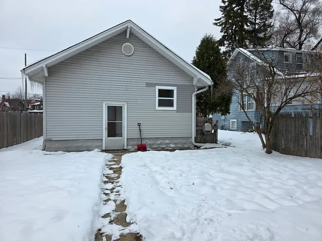 a house with trees in the background