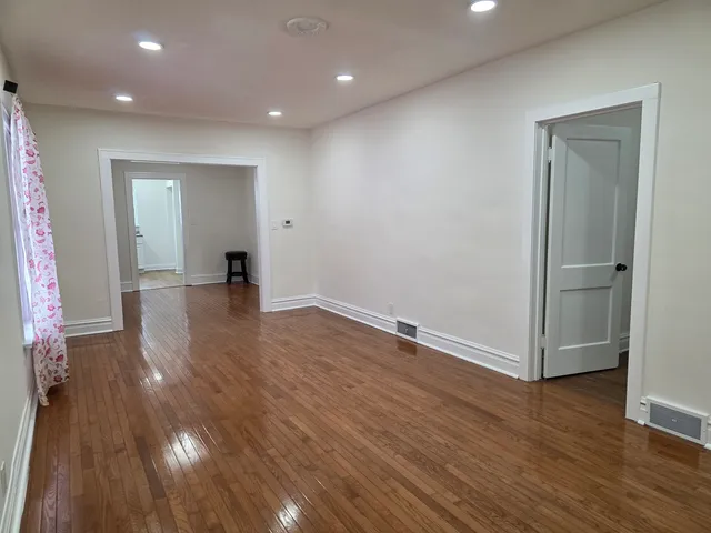 a view of a livingroom with wooden floor
