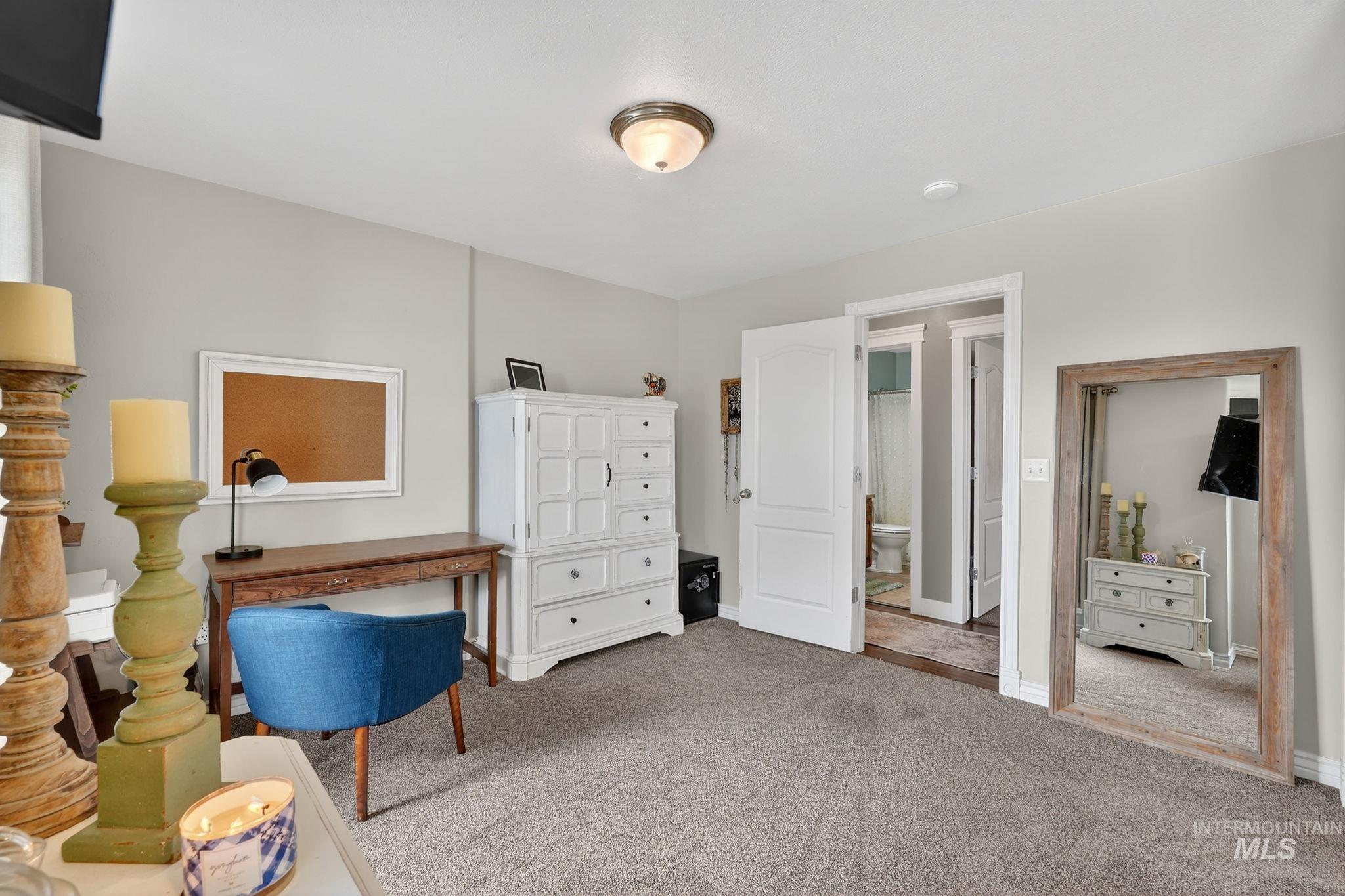 880 Redman Street Chubbuck, ID 83202 - Photo 16 of 39 Sitting room featuring light colored carpet and baseboards