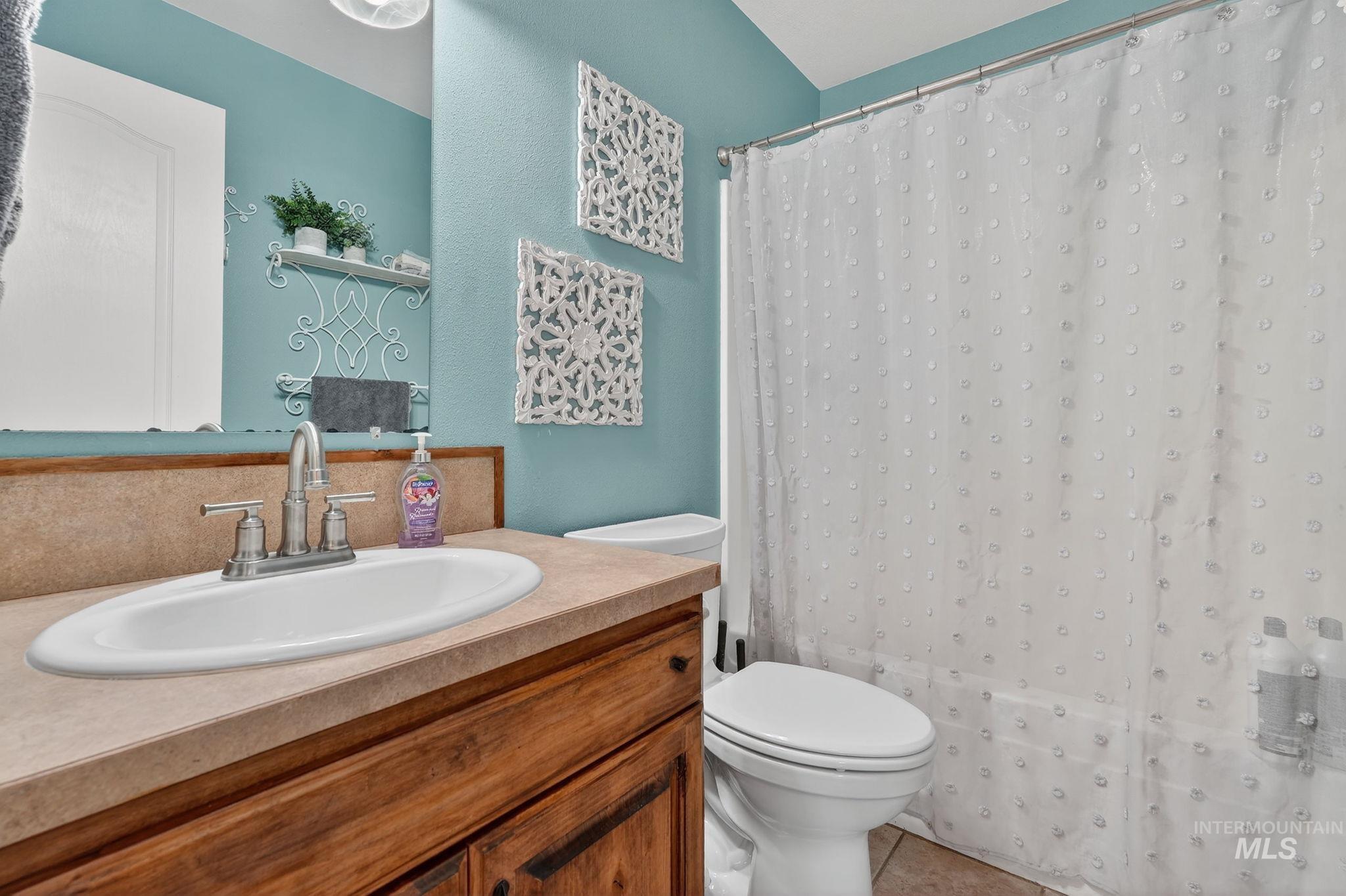 880 Redman Street Chubbuck, ID 83202 - Photo 21 of 39 Full bathroom featuring vanity and light tile patterned floors
