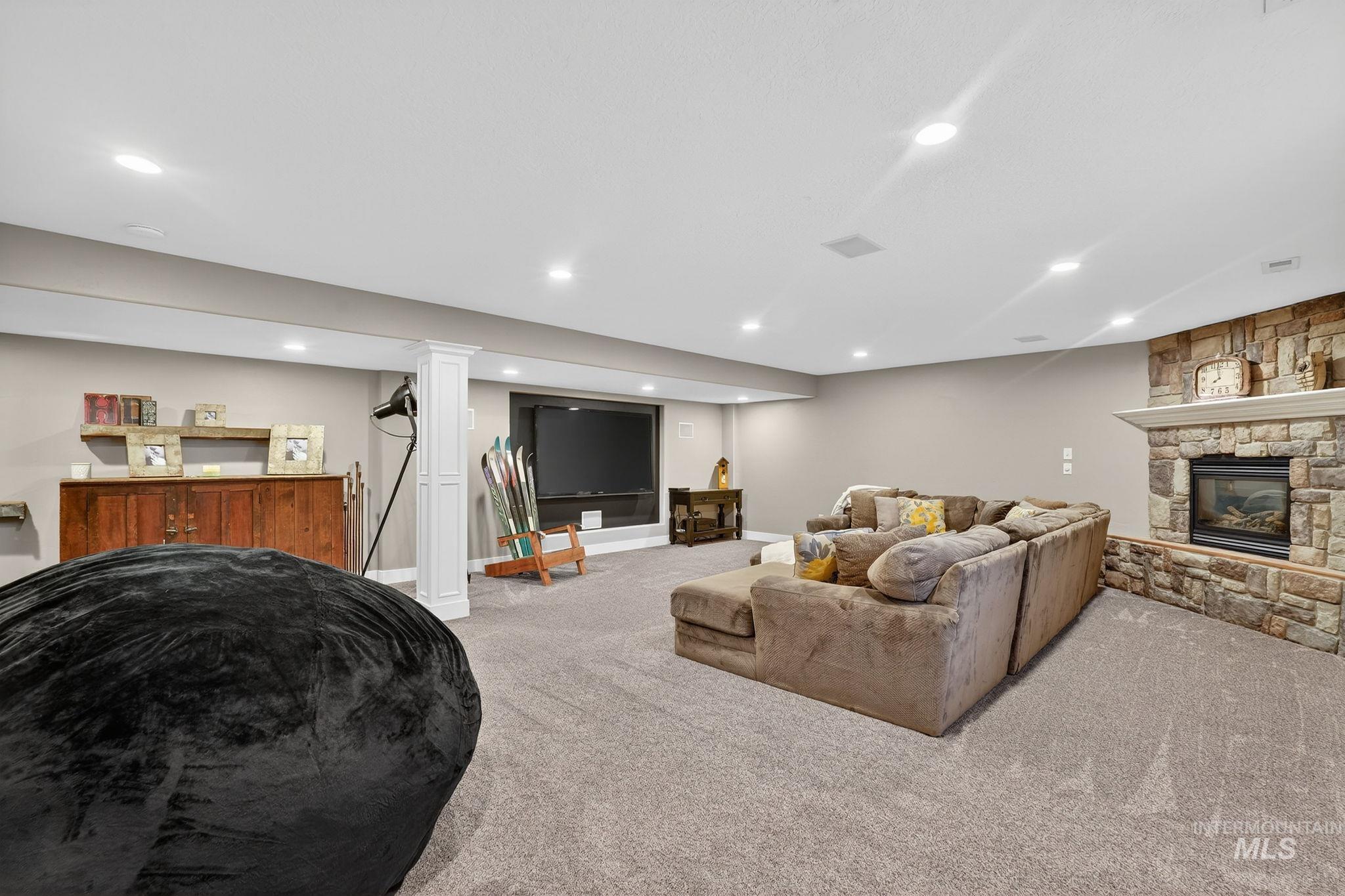 880 Redman Street Chubbuck, ID 83202 - Photo 23 of 39 Living area featuring carpet, a fireplace, and recessed lighting