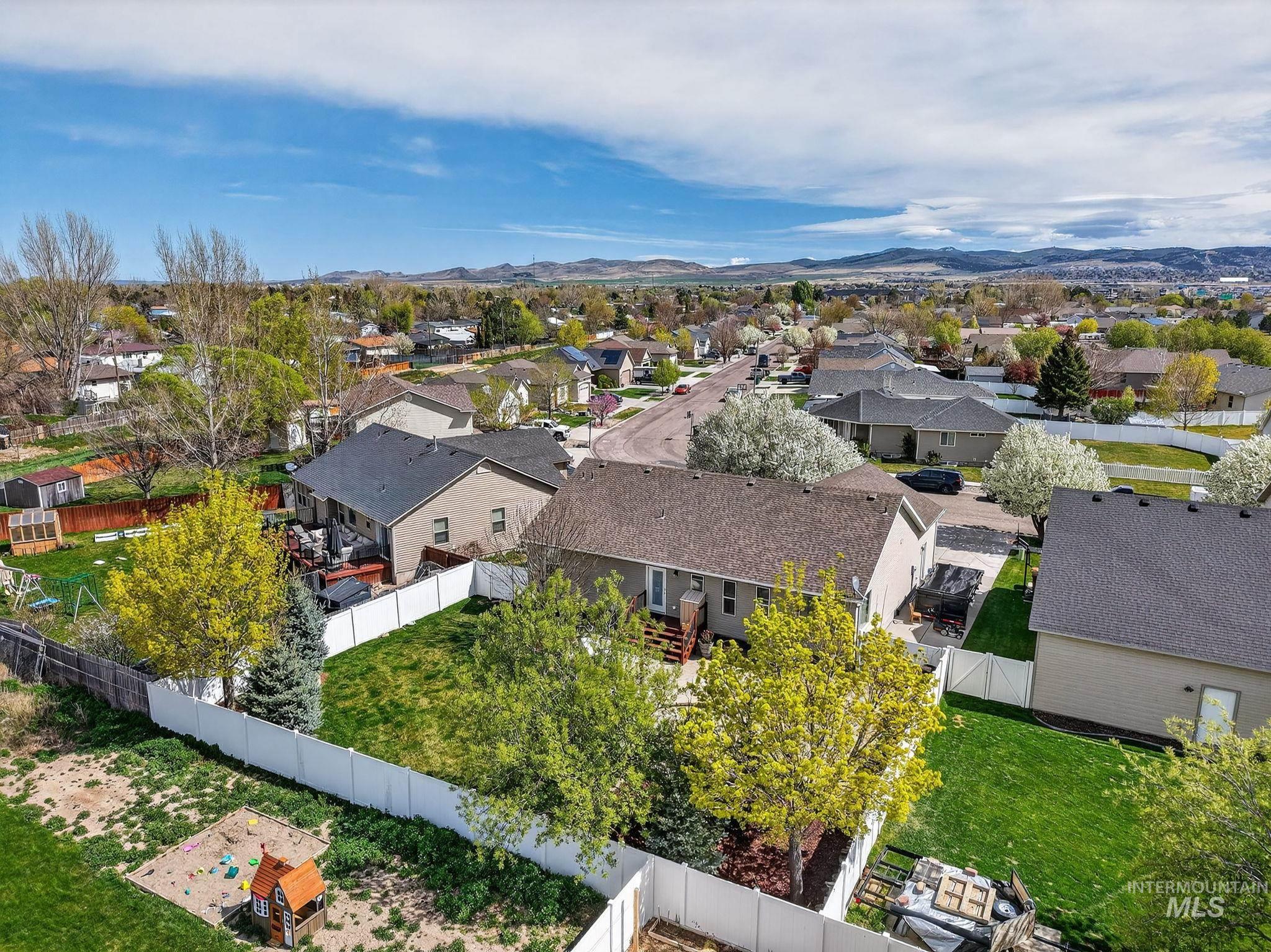 880 Redman Street Chubbuck, ID 83202 - Photo 35 of 39 Aerial view of residential area featuring mountains