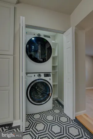 a view of a hallway with washer and dryer