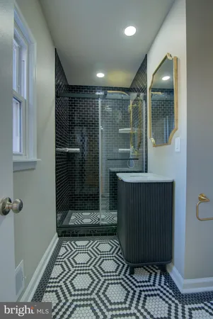a bathroom with a glass door shower