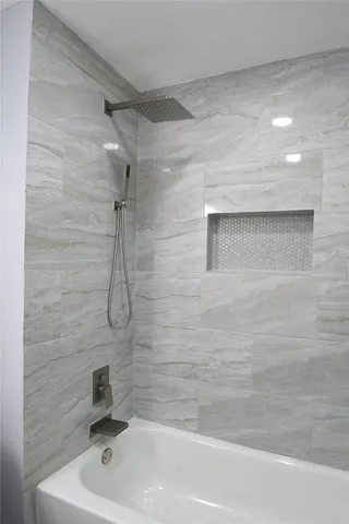a bathroom with a bath tub