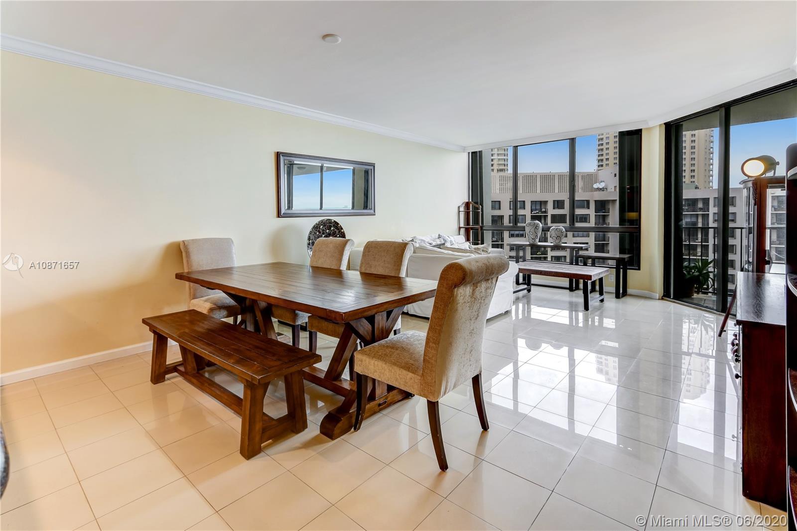520 Brickell Key Drive, Unit A1702 Miami, FL 33131 - Photo 3 of 13 a dining room with furniture and window
