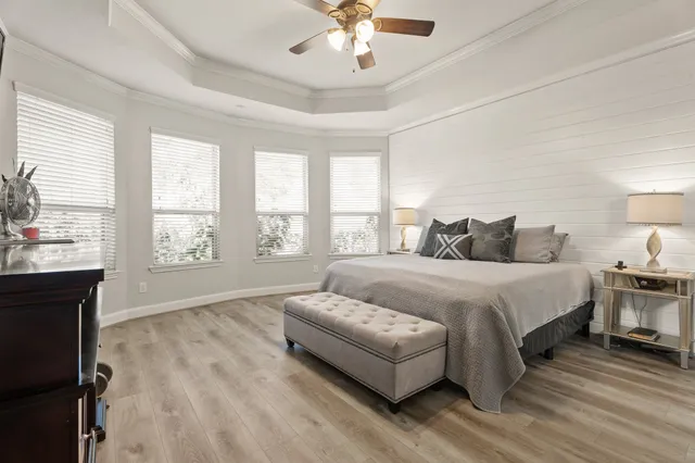 a bedroom with a large bed and a window