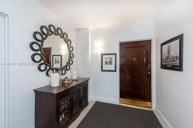 a view of hallway with a mirror