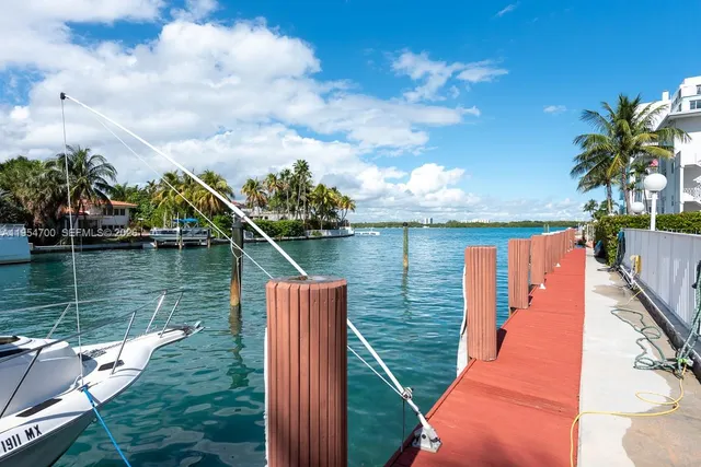a view of a lake with a house in the background