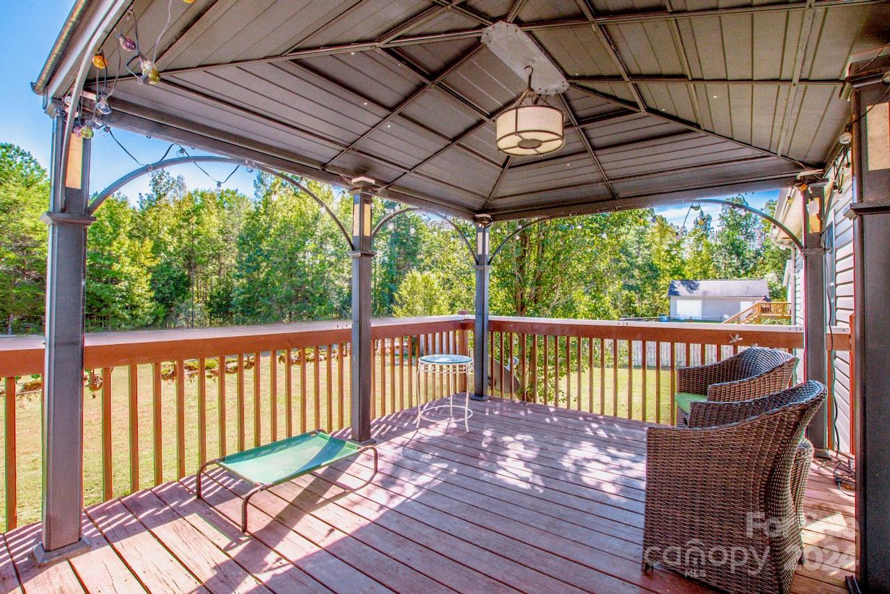 3510 Mack Ballard Road Maiden, NC 28650 - Photo 14 of 26 a view of a wooden deck with a patio