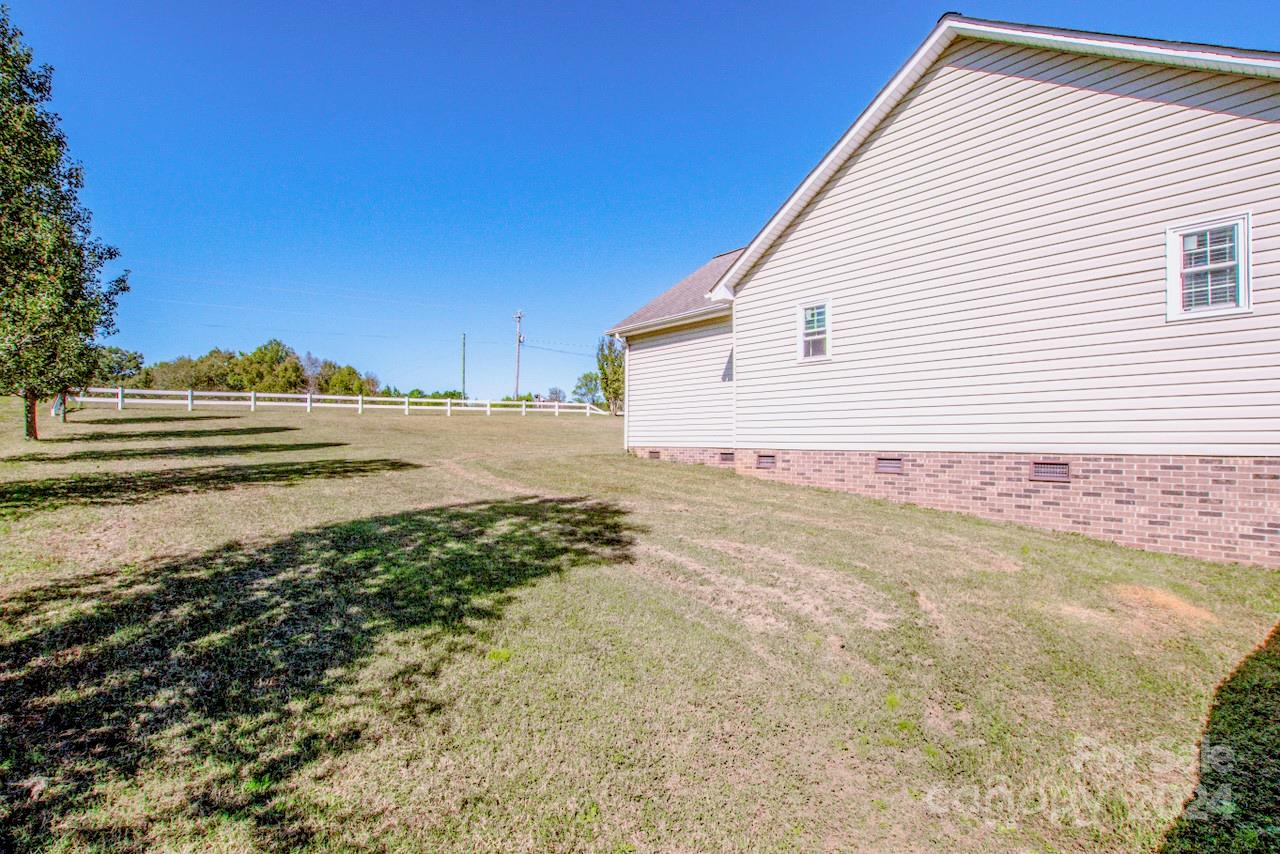 3510 Mack Ballard Road Maiden, NC 28650 - Photo 26 of 26 a view of a house with a yard and sitting area