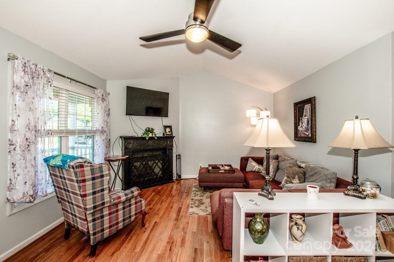 3510 Mack Ballard Road Maiden, NC 28650 - Photo 5 of 26 a living room with furniture a flat screen tv and a fireplace