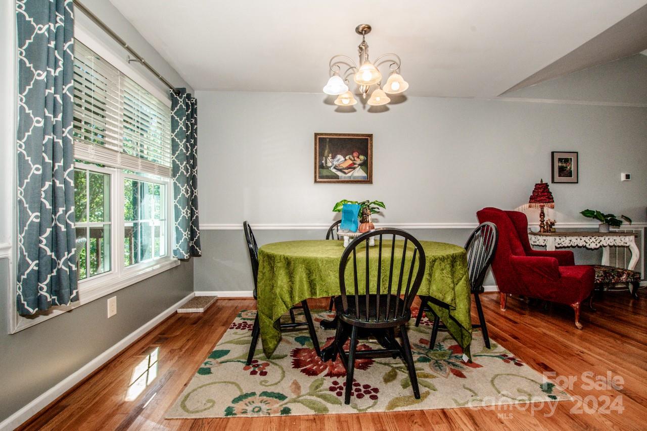3510 Mack Ballard Road Maiden, NC 28650 - Photo 6 of 26 a view of a dining room with furniture a rug and wooden floor