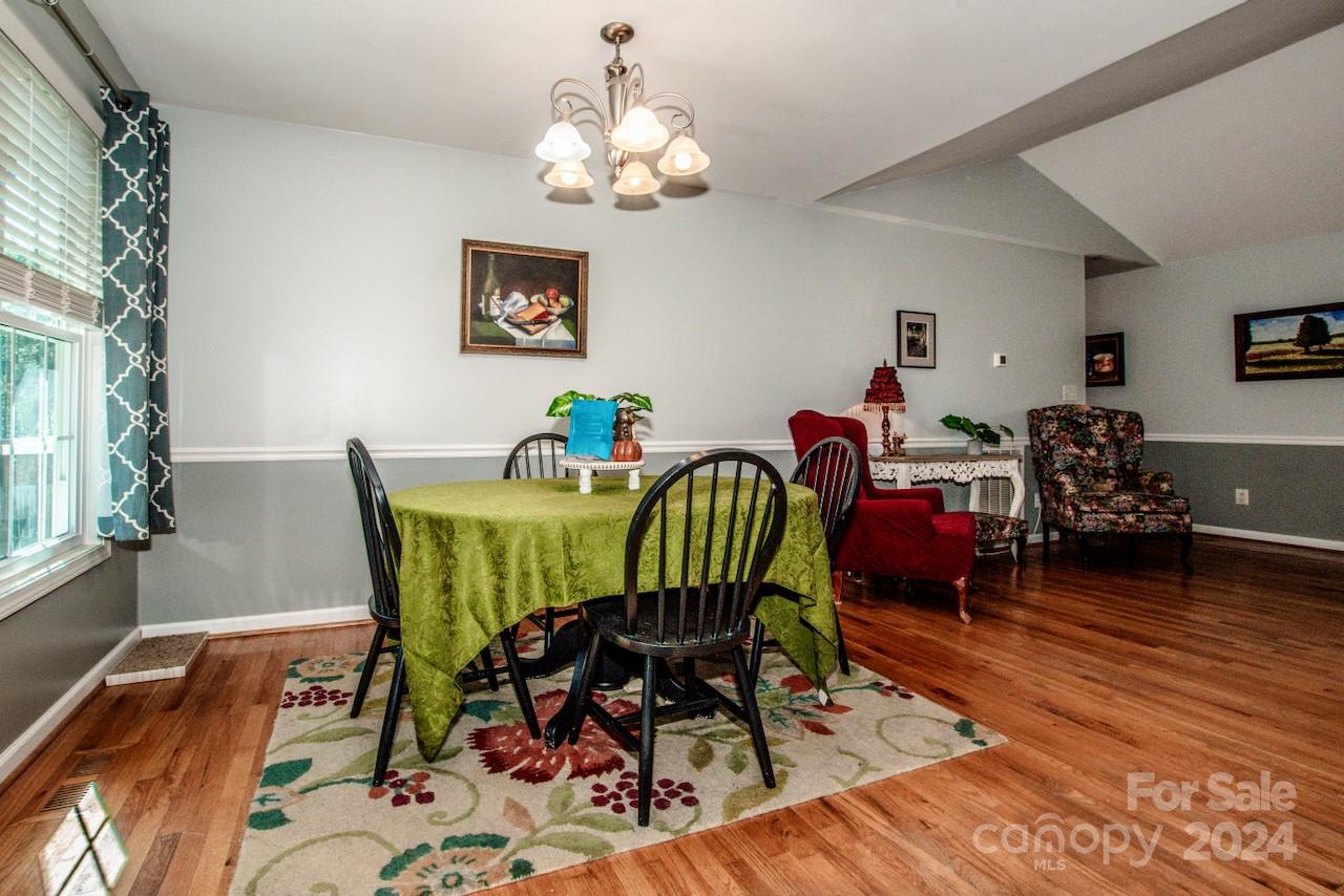 3510 Mack Ballard Road Maiden, NC 28650 - Photo 7 of 26 a view of a dining room with furniture and wooden floor