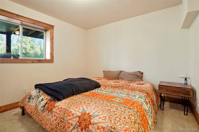 a bathroom with a toilet a sink and shower