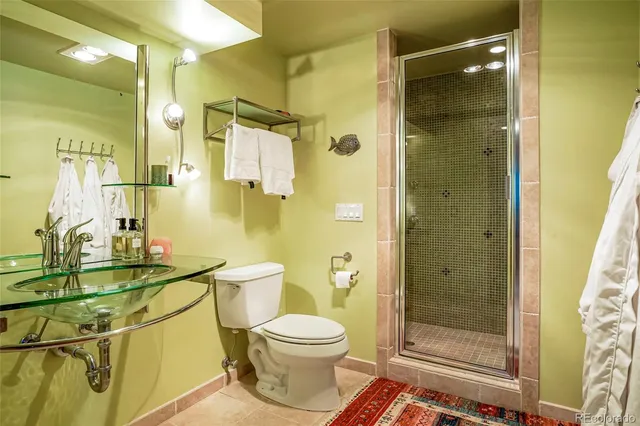 a living room with furniture rug and a fireplace