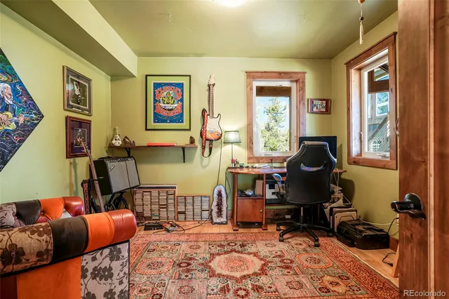a view of an entryway with wooden floor and staircase