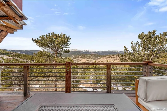 a living room filled with furniture and a large window