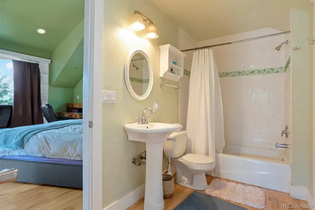 a kitchen with granite countertop a sink cabinets and stainless steel appliances