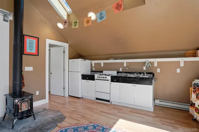a living room with furniture a rug and a large window