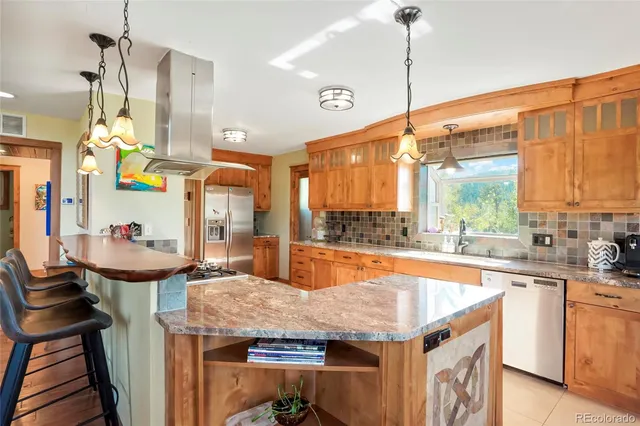 a dining table chairs window and cabinets