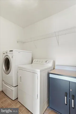 a spacious bathroom with a tub sink shower and mirror
