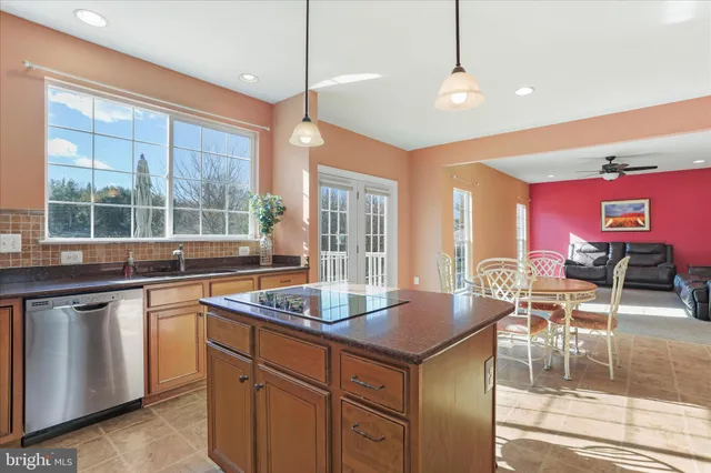 a kitchen with stainless steel appliances granite countertop a stove and a sink