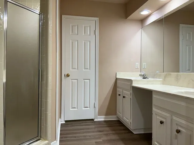 a bathroom with a shower and toilet