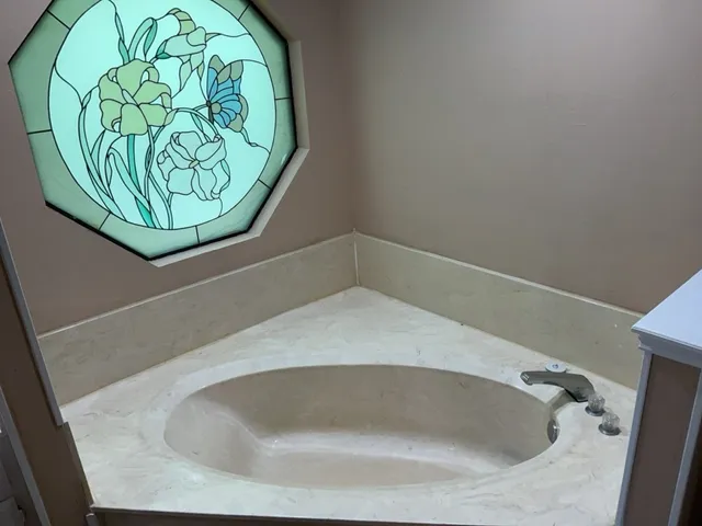 a bathroom with a sink a toilet and bathtub