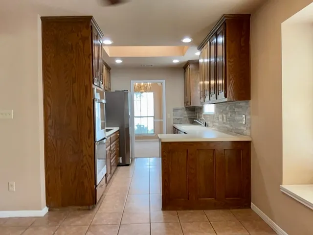 a view of a livingroom with a ceiling fan and window