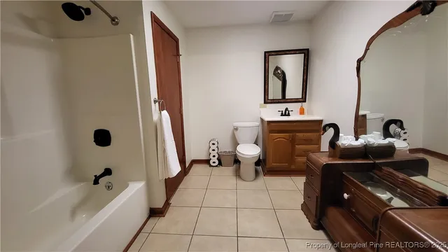 a bed room with a bed and a television