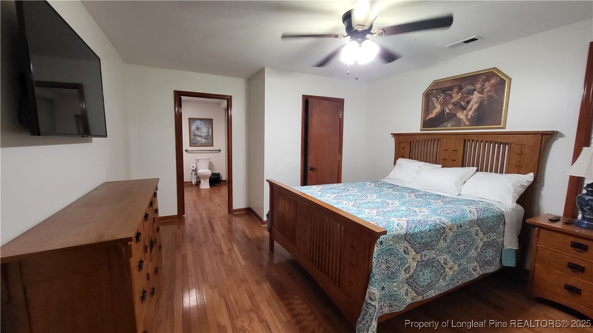 1790 Rozier Church Road Lumberton, NC 28360 - Photo 9 of 12 a bed room with a bed and a television