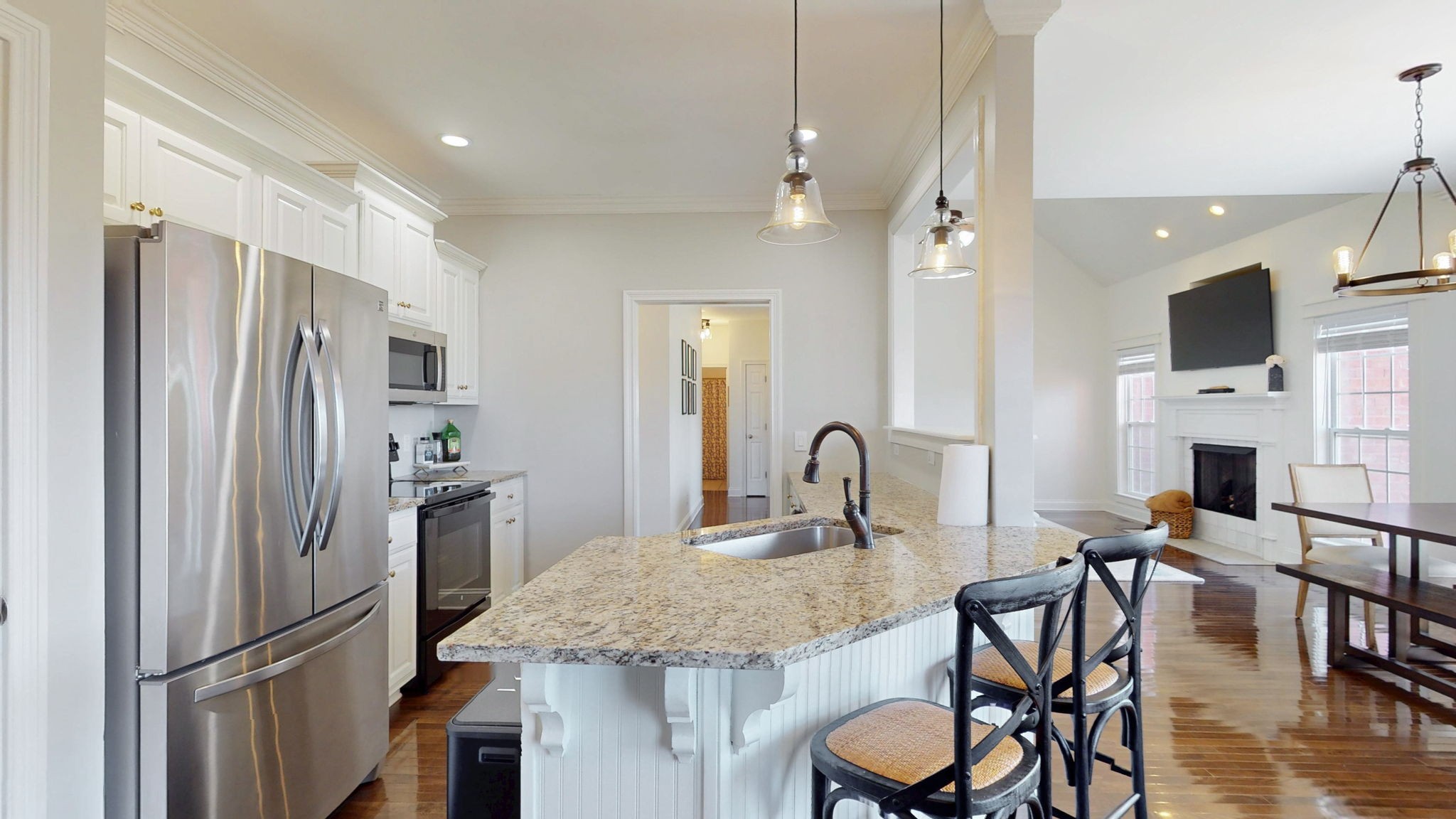 864 Bradshaw Road Lebanon, TN 37087 - Photo 12 of 41 a kitchen with granite countertop a table chairs refrigerator and microwave