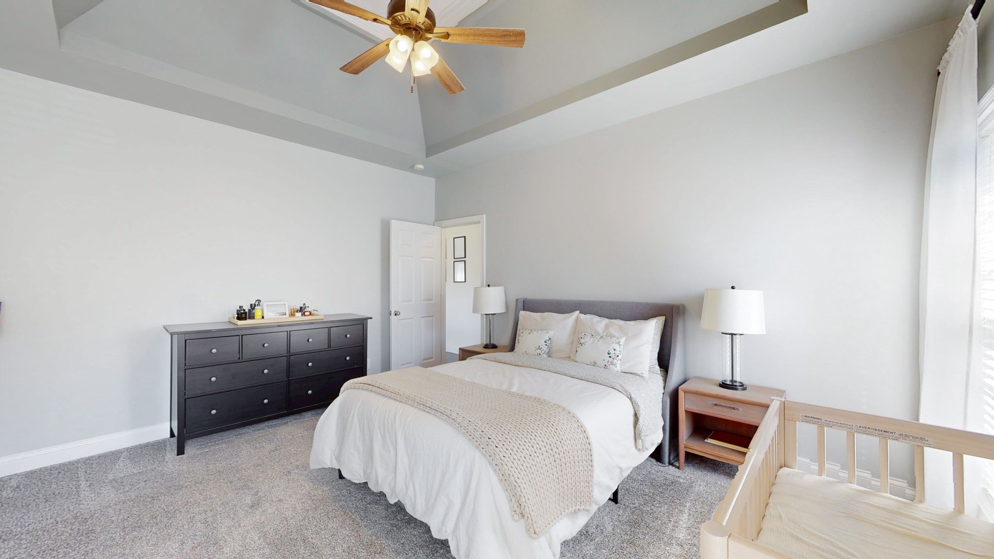 864 Bradshaw Road Lebanon, TN 37087 - Photo 15 of 41 a bedroom with a bed and a chandelier