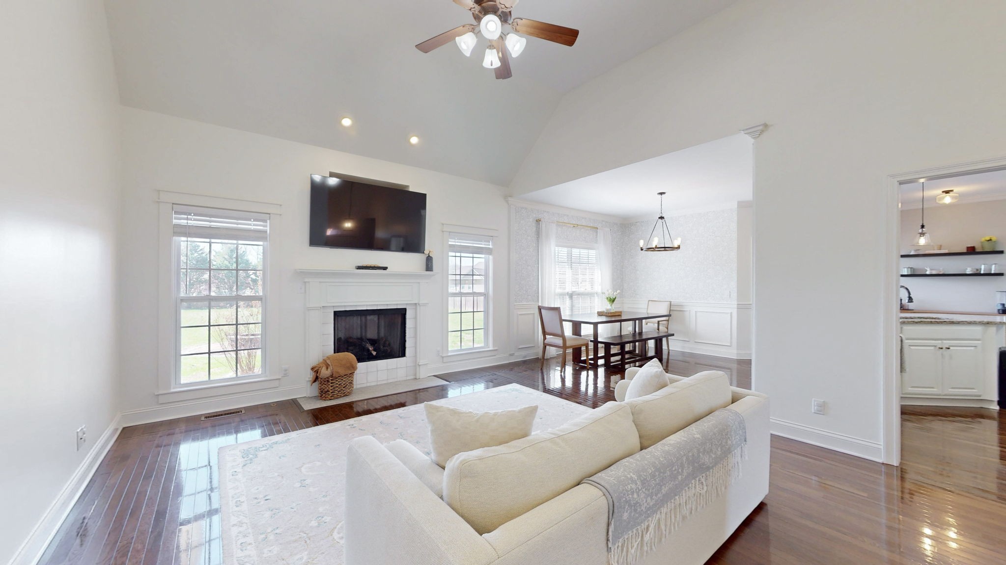 864 Bradshaw Road Lebanon, TN 37087 - Photo 2 of 41 a living room with furniture a flat screen tv and a fireplace