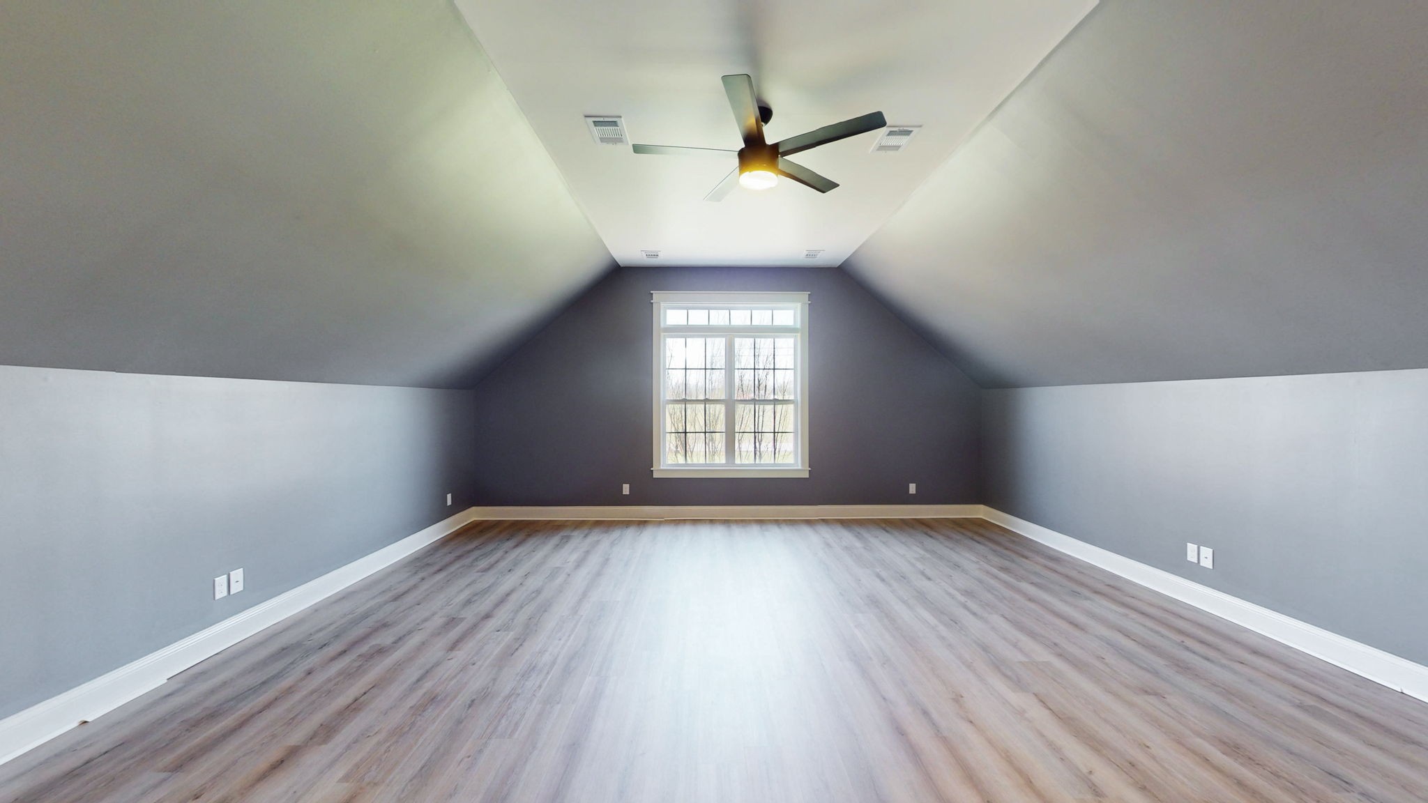 864 Bradshaw Road Lebanon, TN 37087 - Photo 26 of 41 an empty room with wooden floor fan and windows