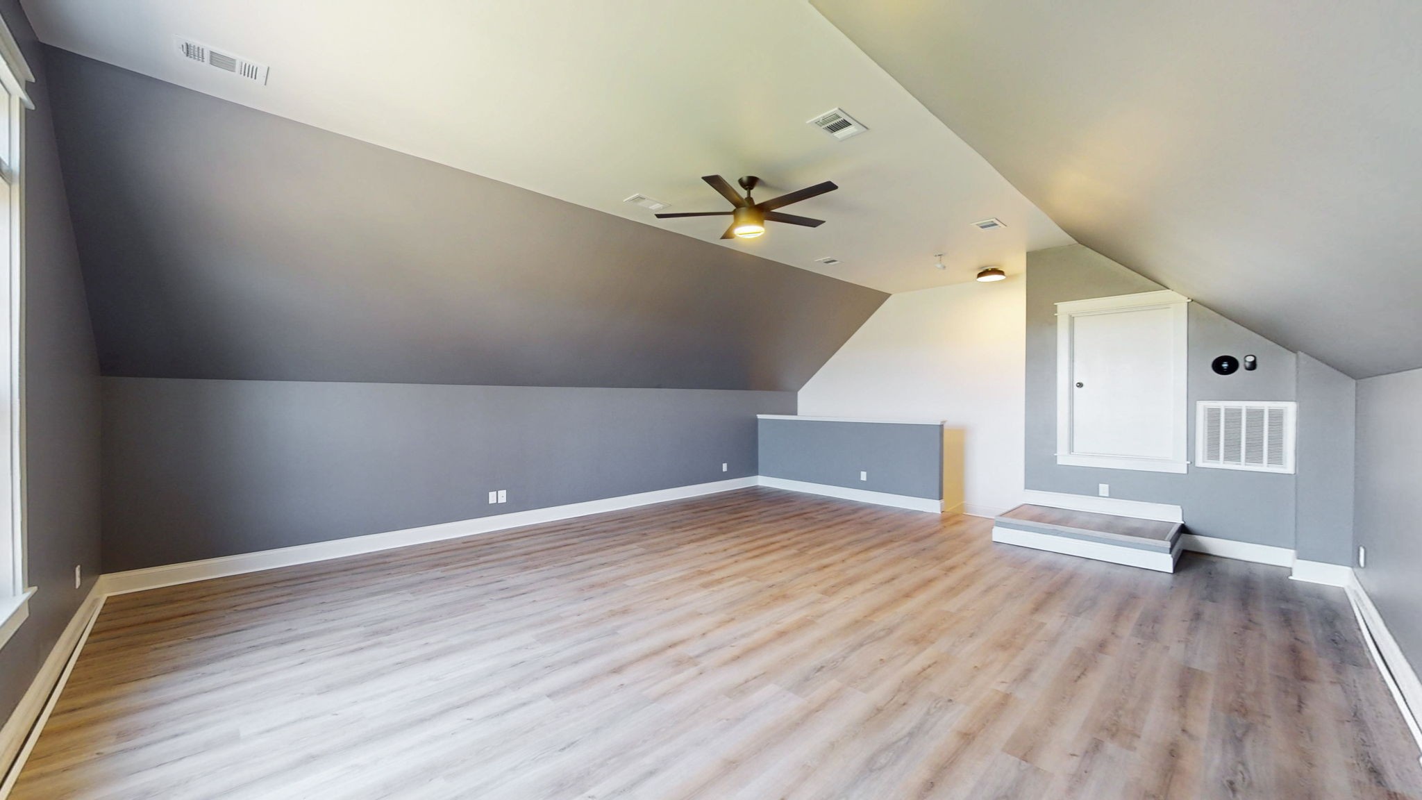 864 Bradshaw Road Lebanon, TN 37087 - Photo 27 of 41 an empty room with wooden floor ceiling fan and windows