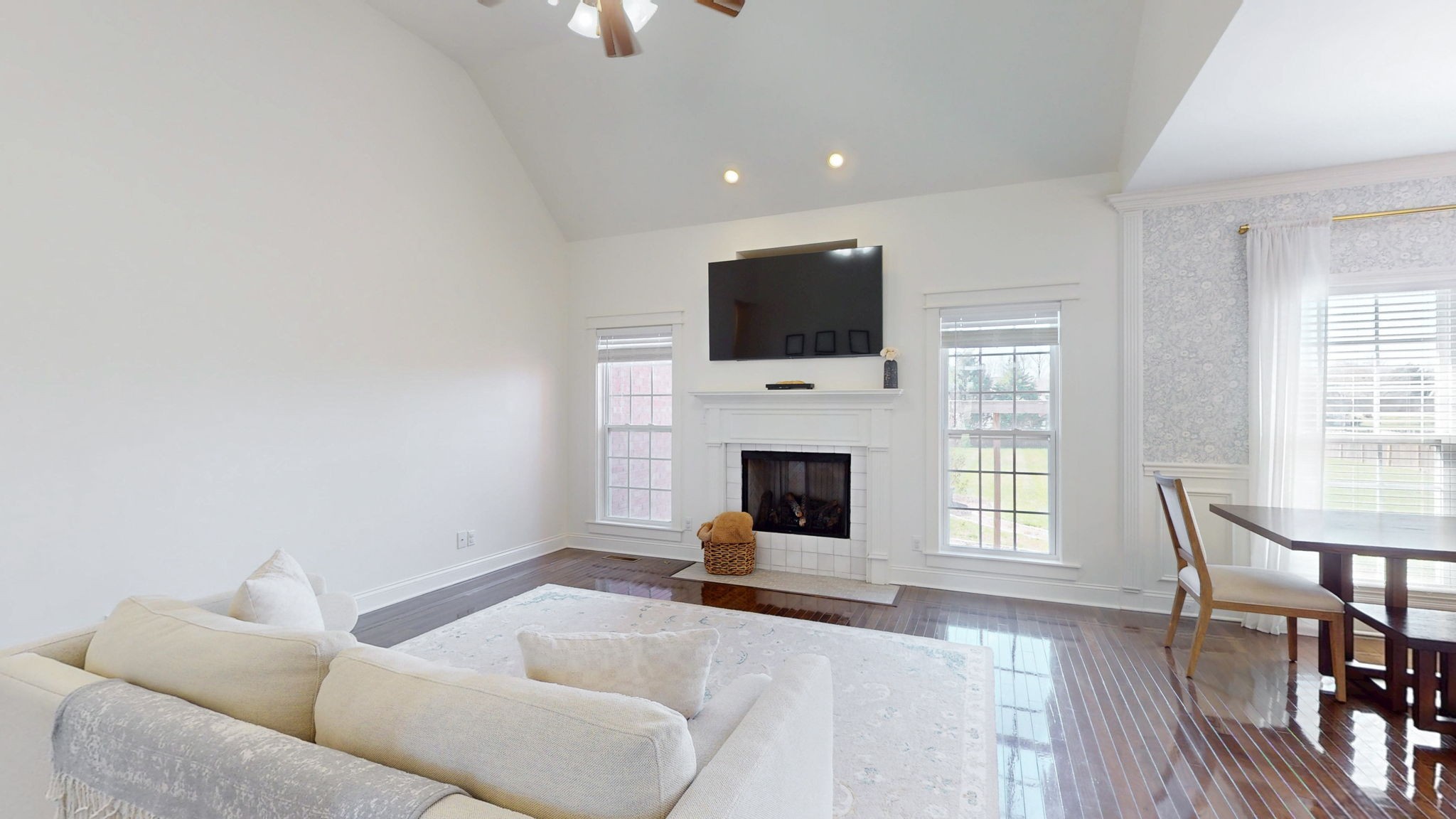 864 Bradshaw Road Lebanon, TN 37087 - Photo 7 of 41 a living room with furniture a flat screen tv and a fireplace
