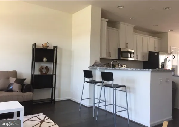 a kitchen with cabinets and appliances