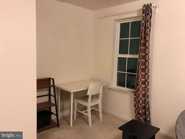 a view of a workspace with furniture