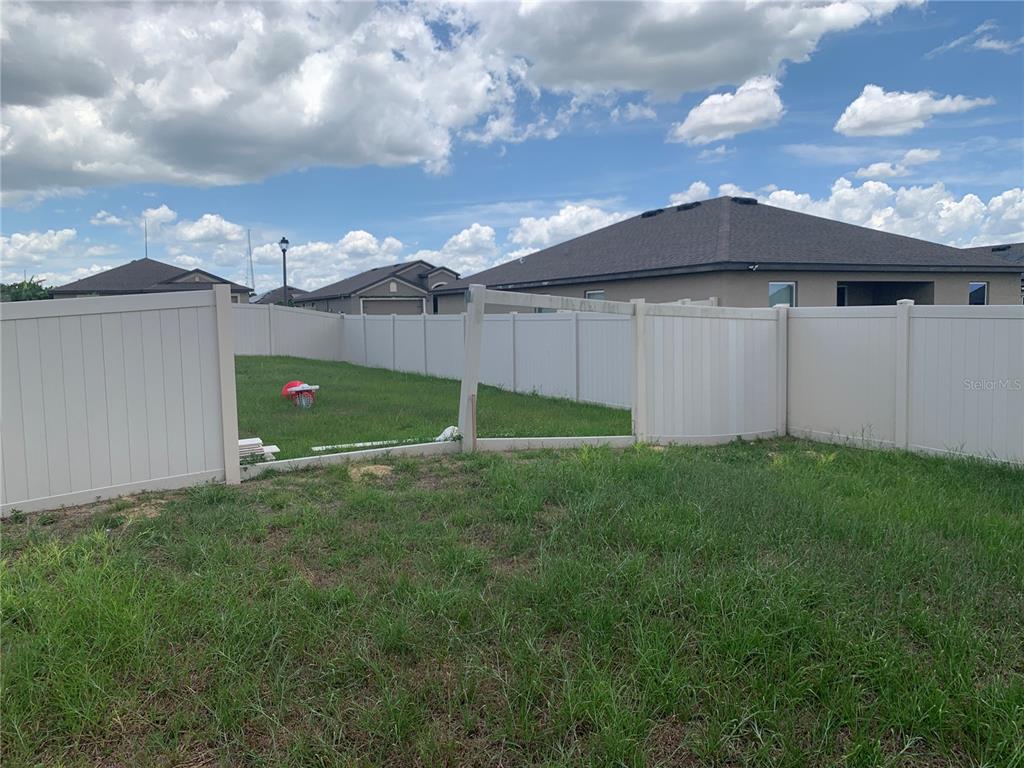 2187 Mandarin Loop Dundee, FL 33838 - Photo 11 of 11 a view of a backyard