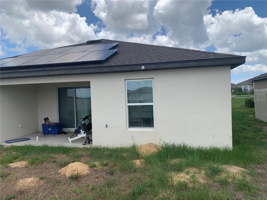 2187 Mandarin Loop Dundee, FL 33838 - Photo 6 of 11 a front view of a house with garden