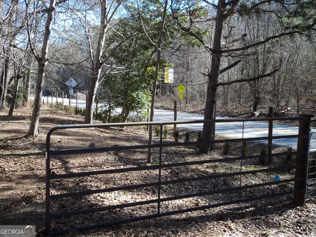 a view of a street with a tree